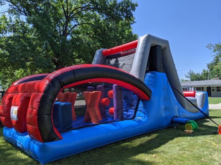 Corner view of set up 35 foot inflatable obstacle courses, inflatable water slide