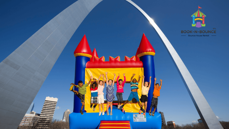 kids jumping on bounce house under st. louis arch